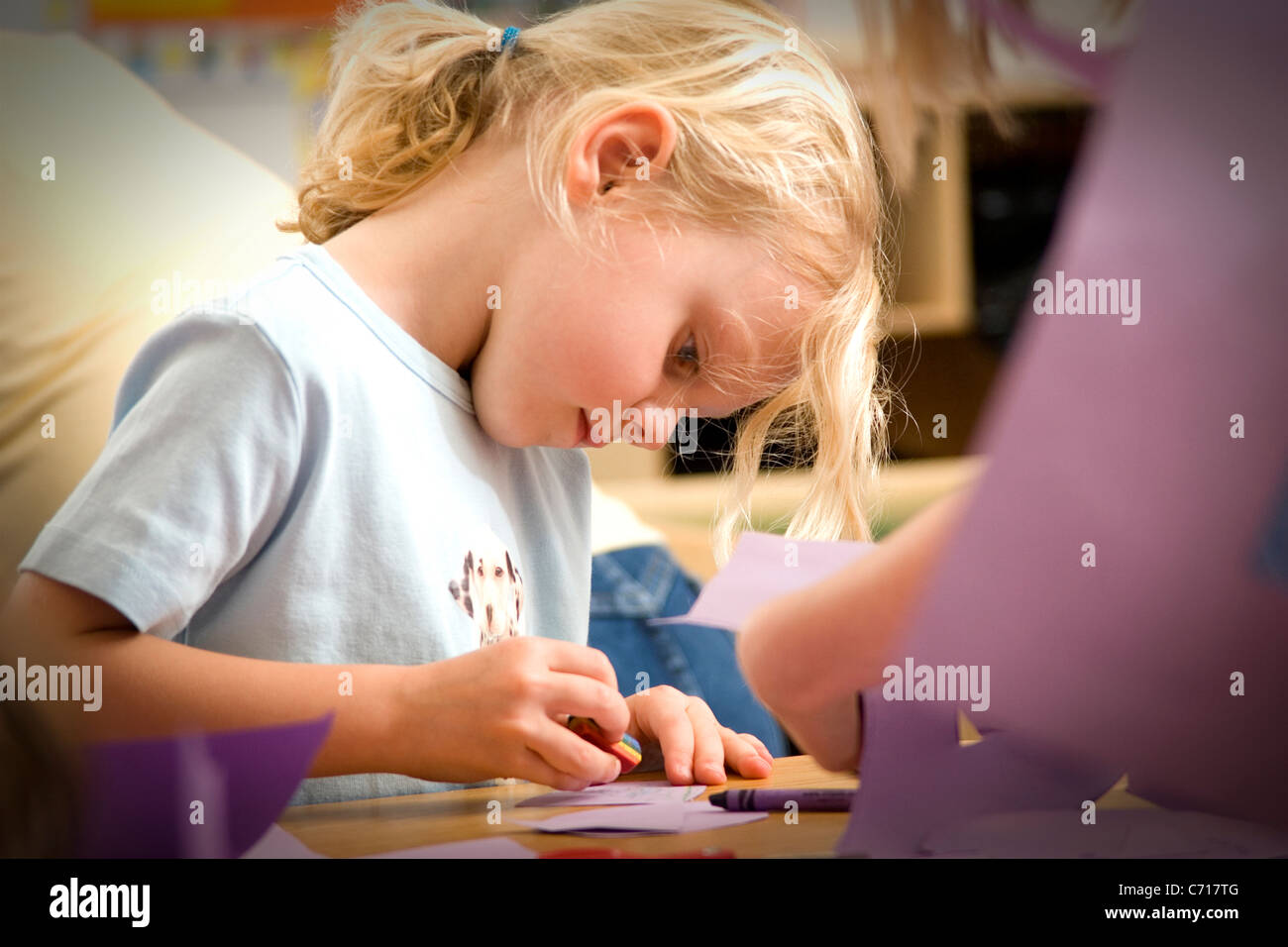 Cute little girl holding an eraser Stock Photo Alamy