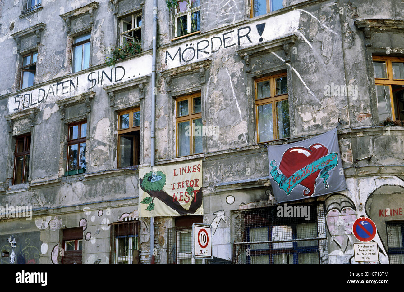 'Soldiers are murderers'. One of the few remaining squatted apartment buildings in Mitte district of Berlin. Stock Photo
