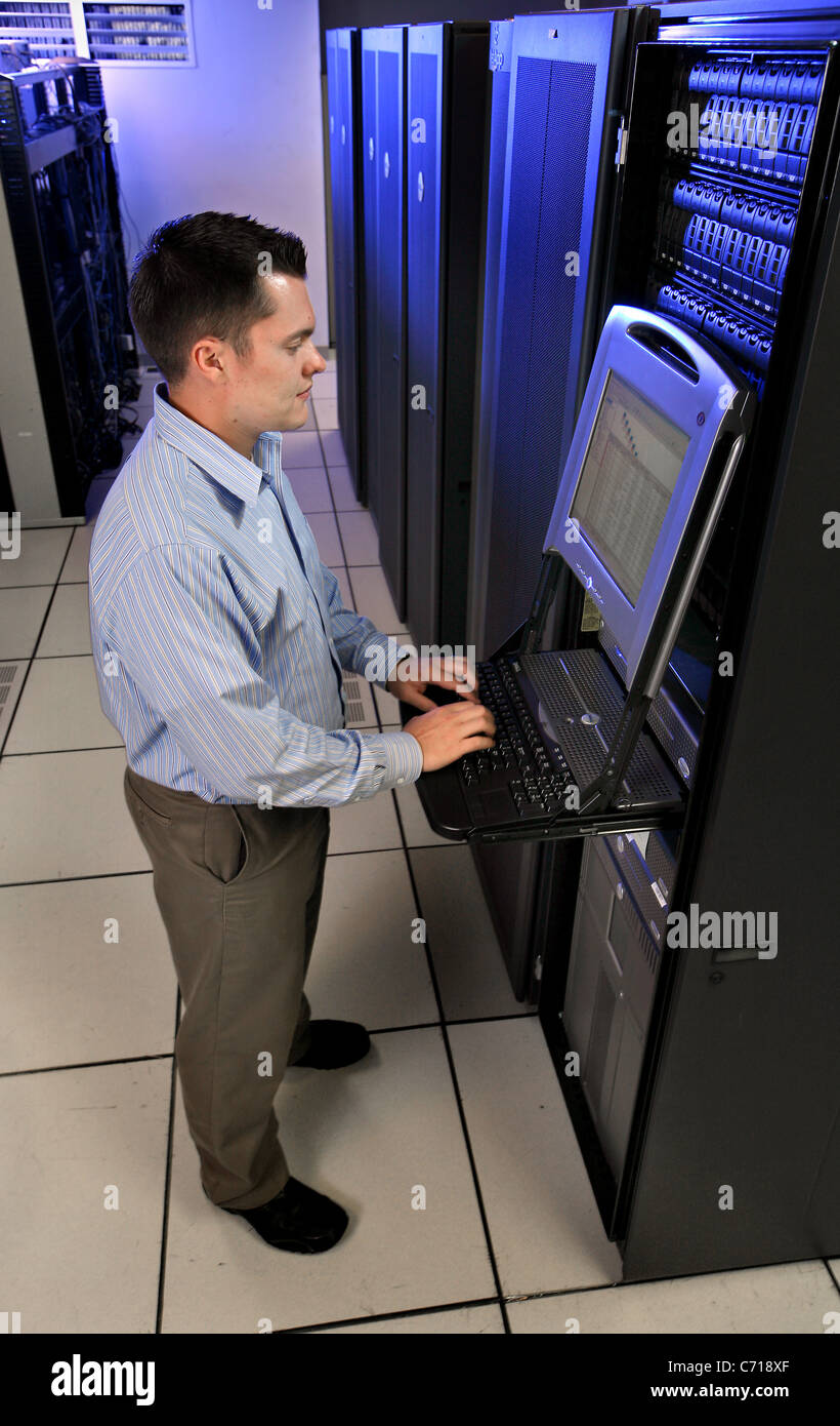 Working on the servers in Information Technology. Stock Photo