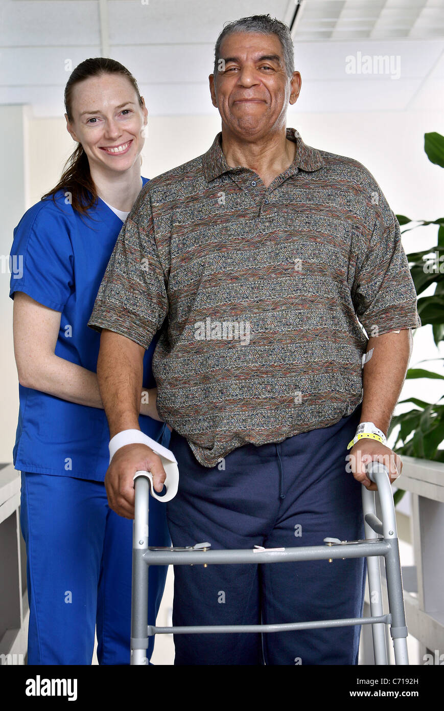 A physical therapist works with a patient. Stock Photo