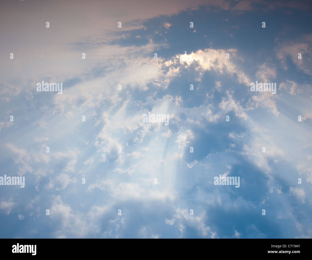 Sunbeams through clouds Stock Photo