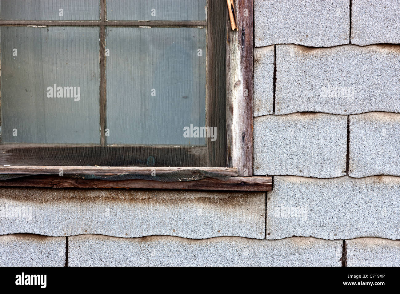 Asbestos composition shingles, exterior wall Stock Photo