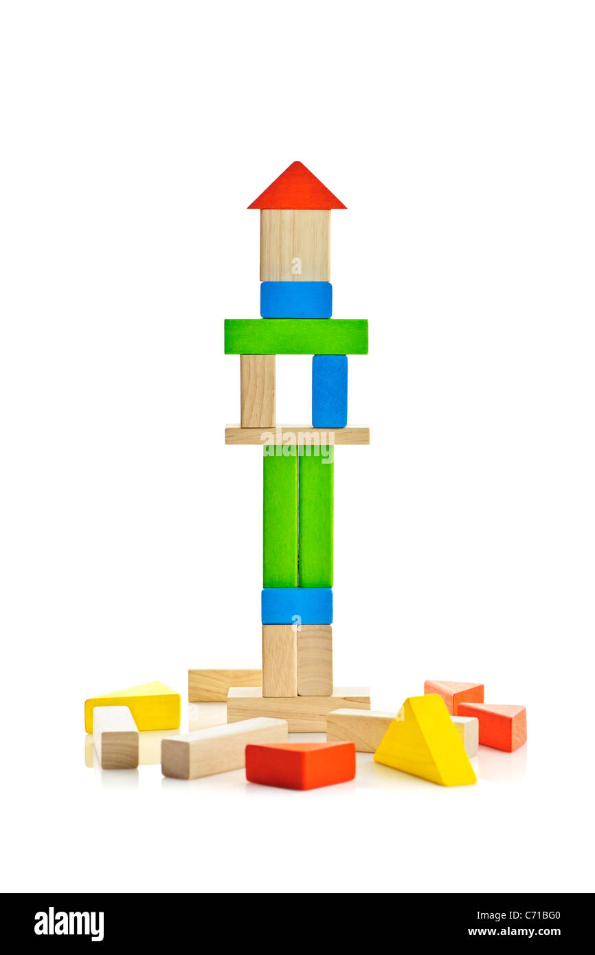 Tower of wooden building block toys isolated on white background Stock Photo