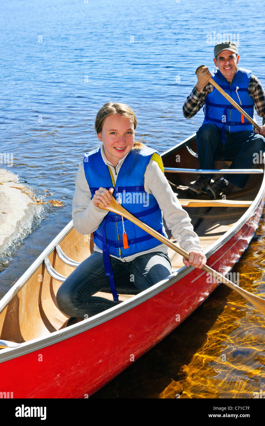 Father and daughter canoeing on Lake of Two Rivers, Ontario, Canada Stock Photo