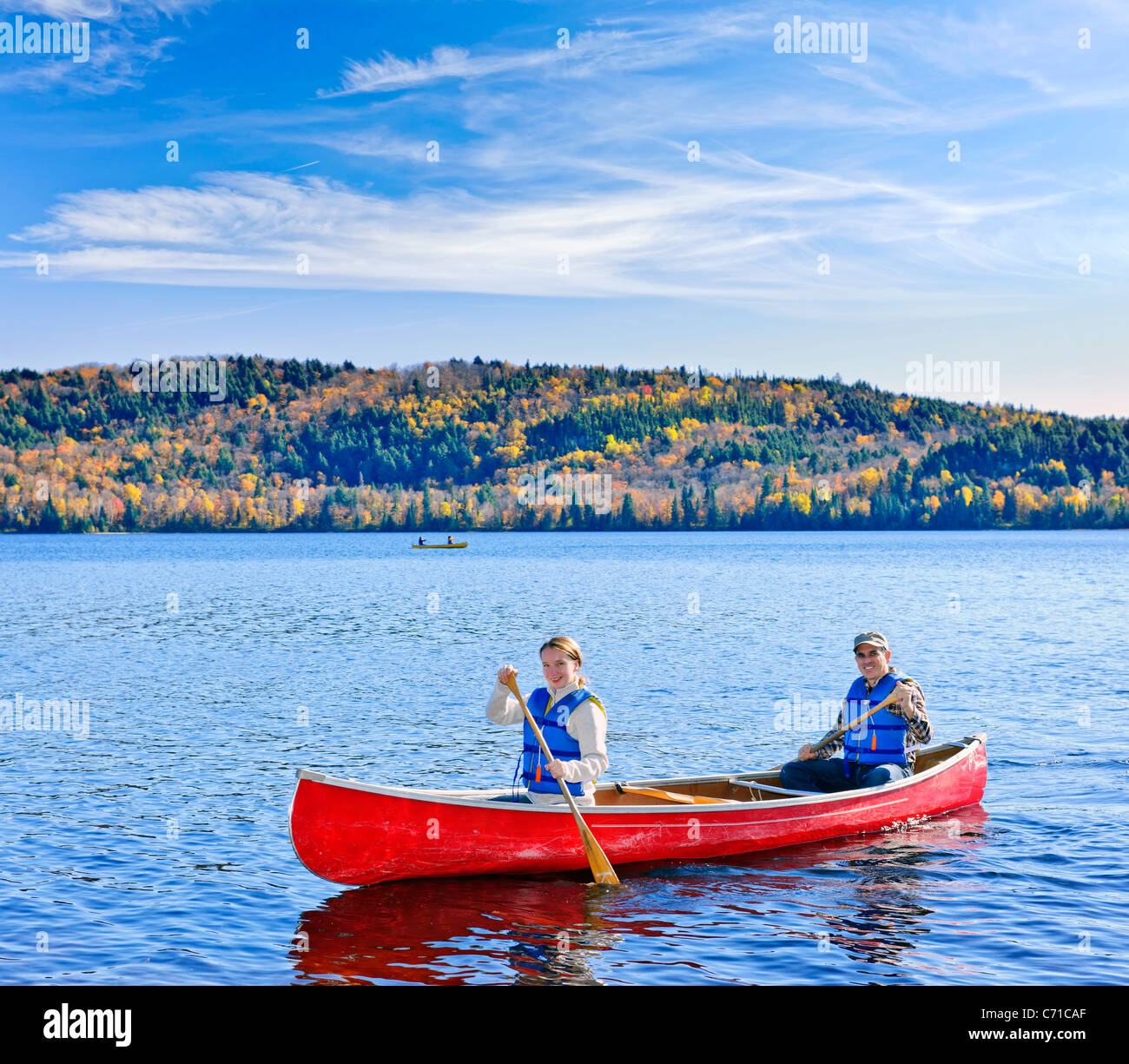 Father and daughter canoeing on Lake of Two Rivers, Ontario, Canada