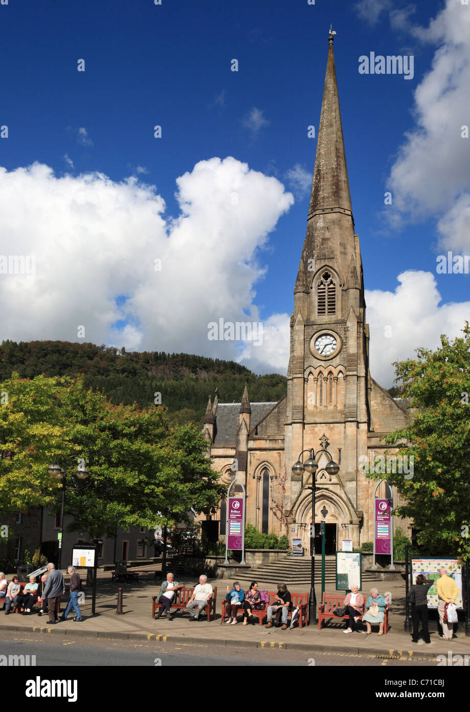 People sitting in front of Callander tourist information and Rob Roy centre, Stirling, Scotland. Stock Photo