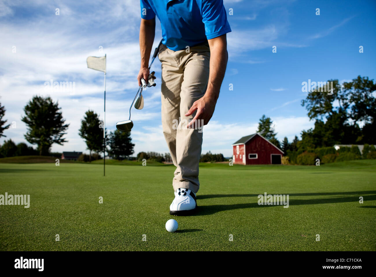 Man walking towards his golf ball Stock Photo Alamy