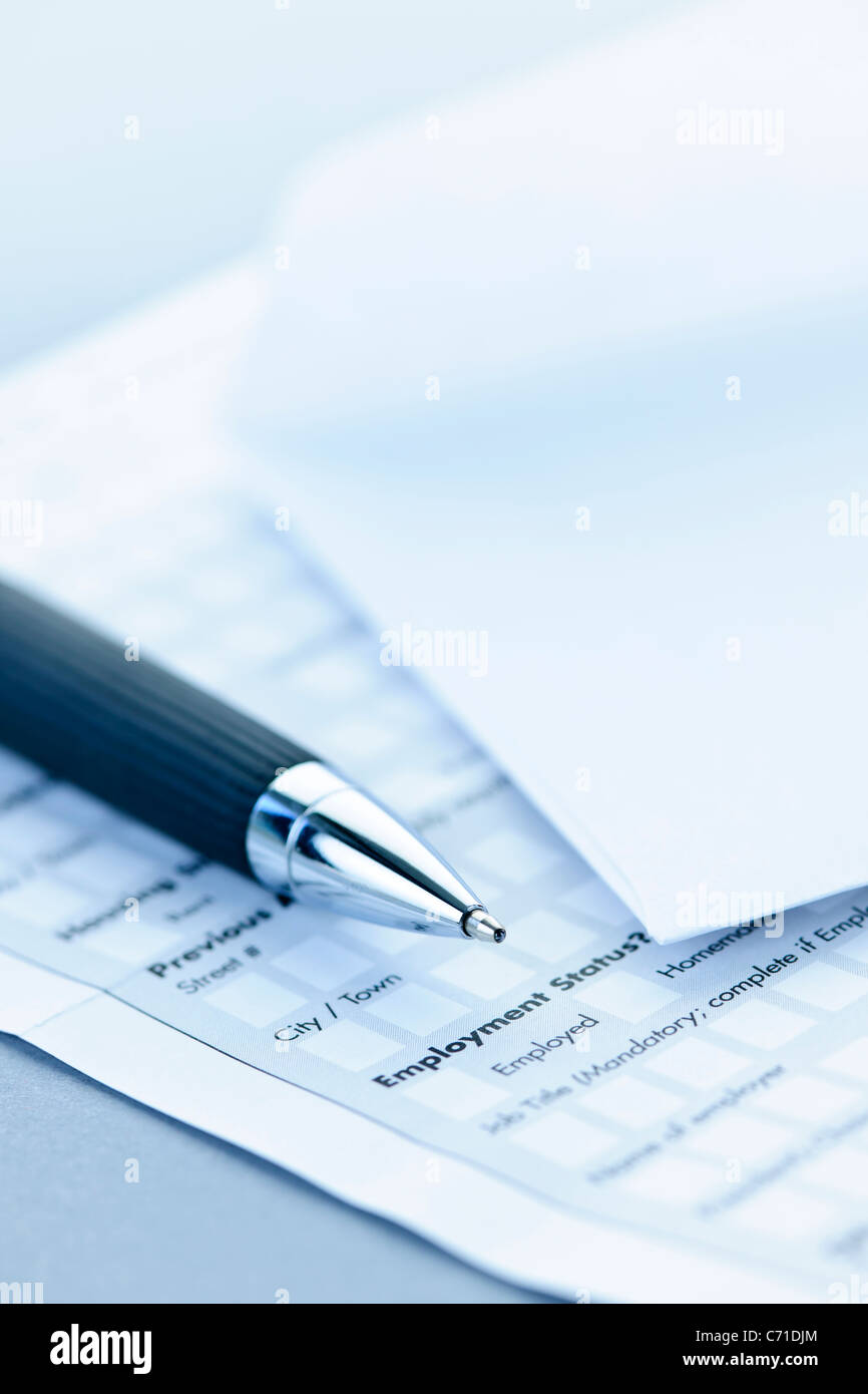 Blank credit application form with envelope and pen close up Stock Photo