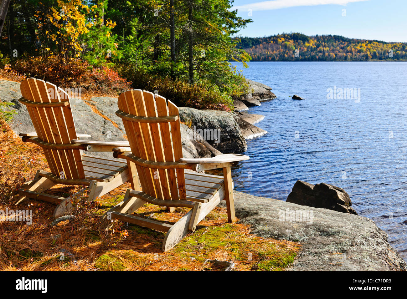 Adirondack chairs at shore of Lake of Two Rivers, Ontario, Canada Stock