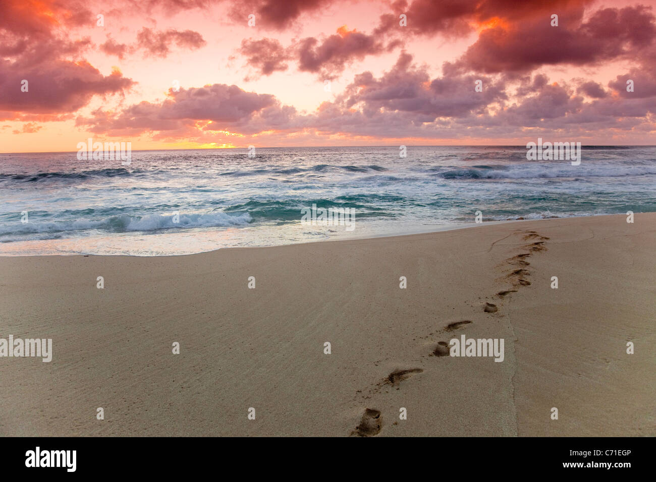 A red sky sunset over Sunset beach in Hawaii. Stock Photo