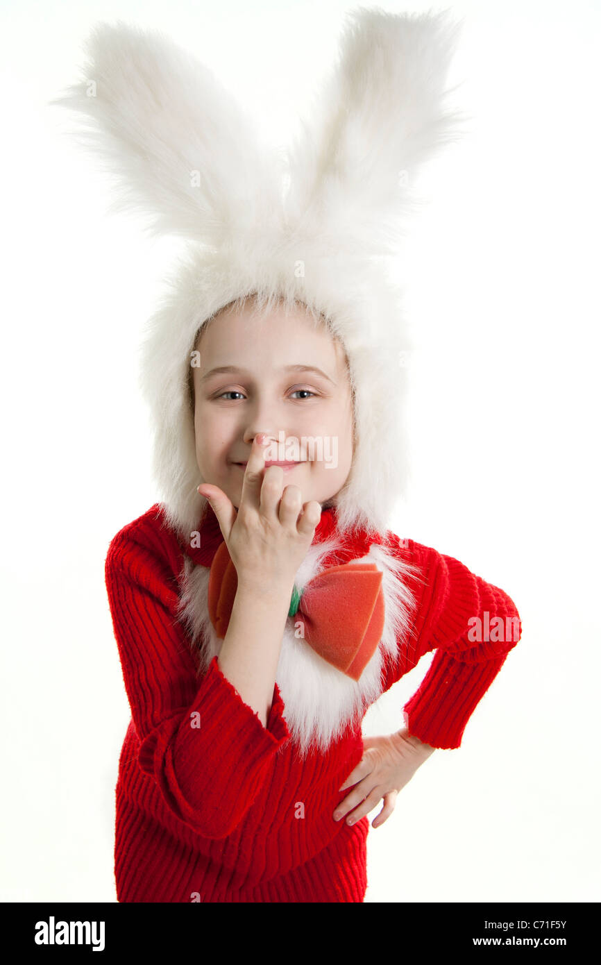 Сhild in a white downy bunny costume. Stock Photo