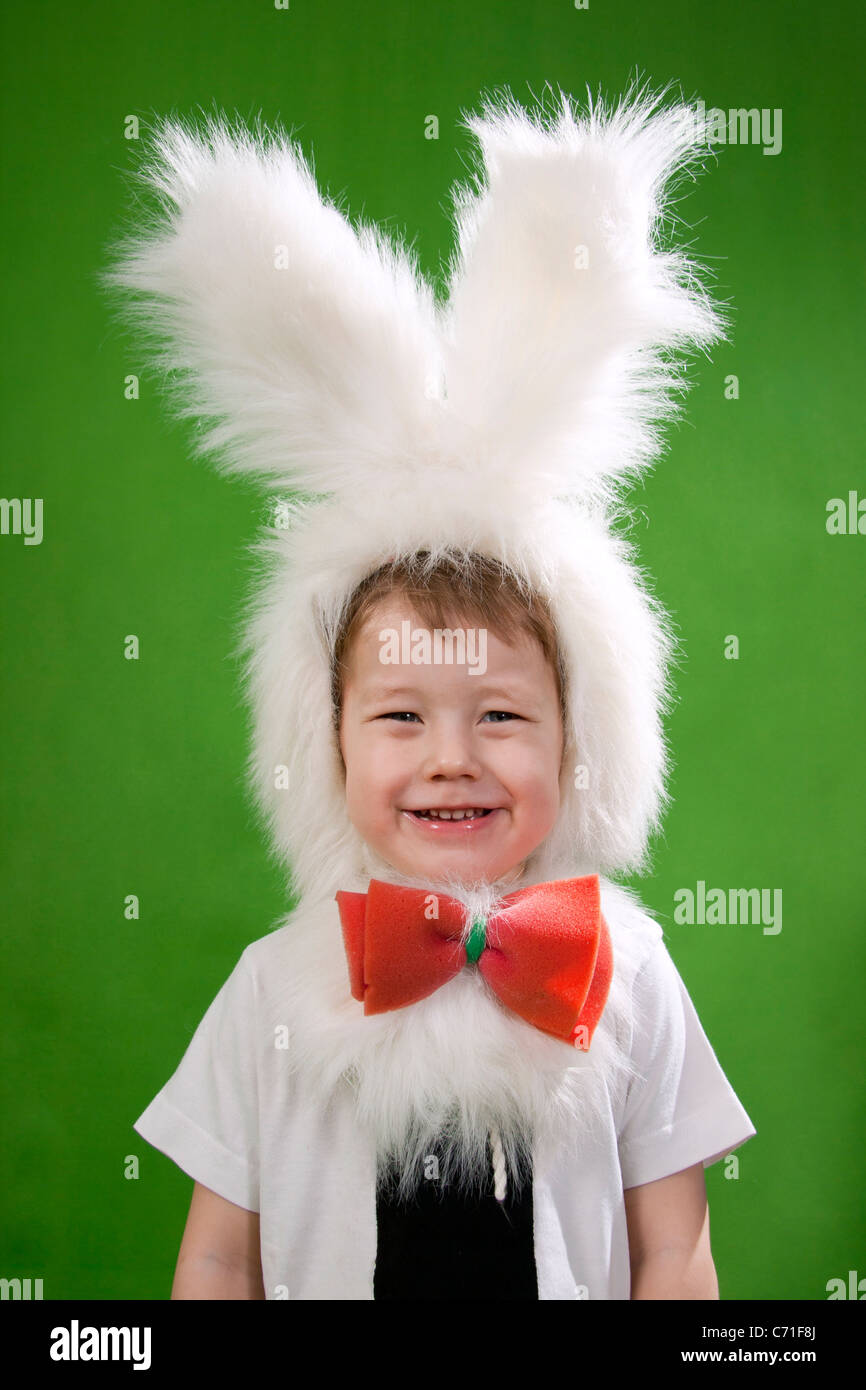 Boy in a white downy bunny costume Stock Photo Alamy
