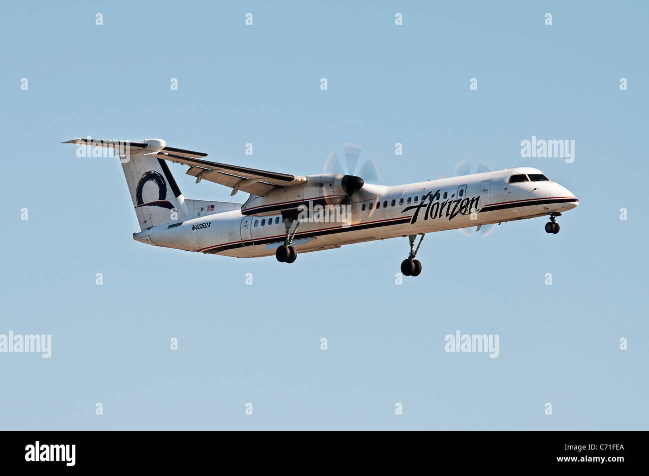 A Horizon Air Bombardier Dash 8 (DHC-8-402Q) regional airliner on final approach for landing, Vancouver International Airport. Stock Photo