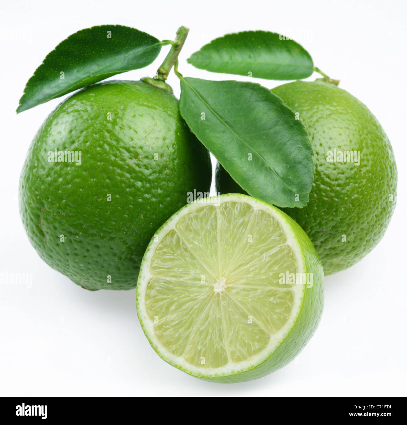 Lime with leaves on white background. Stock Photo