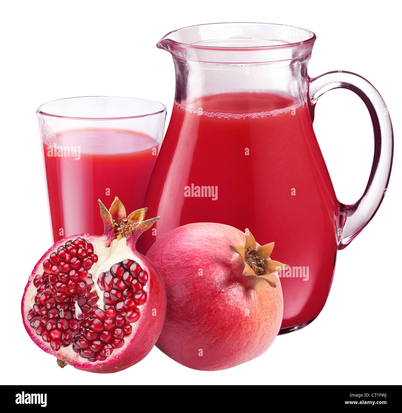 Pomegranate juice in pitcher and pomegranates. Isolated on white
