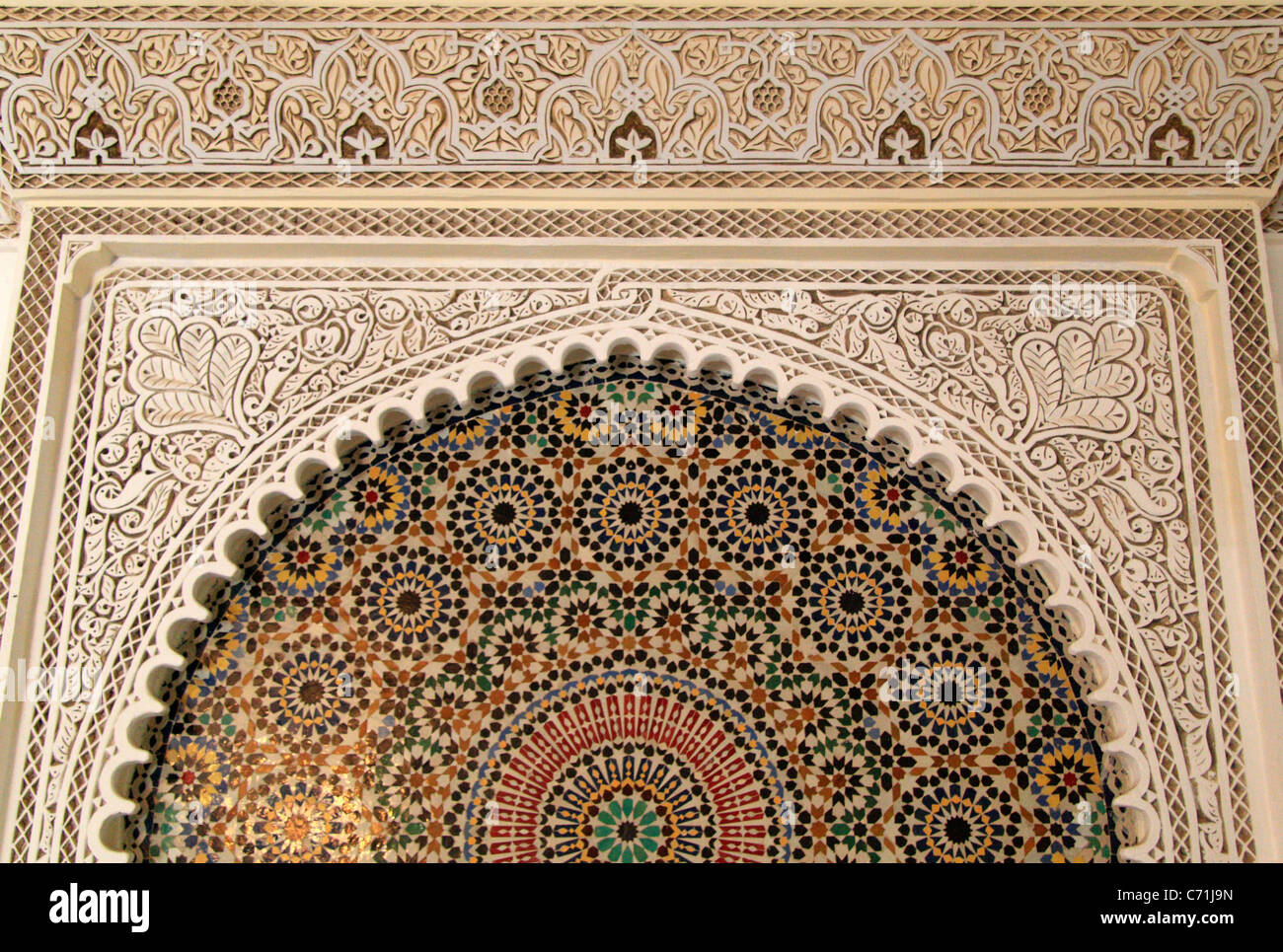 Water fountain with mosaic tilework and stucco design, Morocco, North Africa - detail Stock Photo