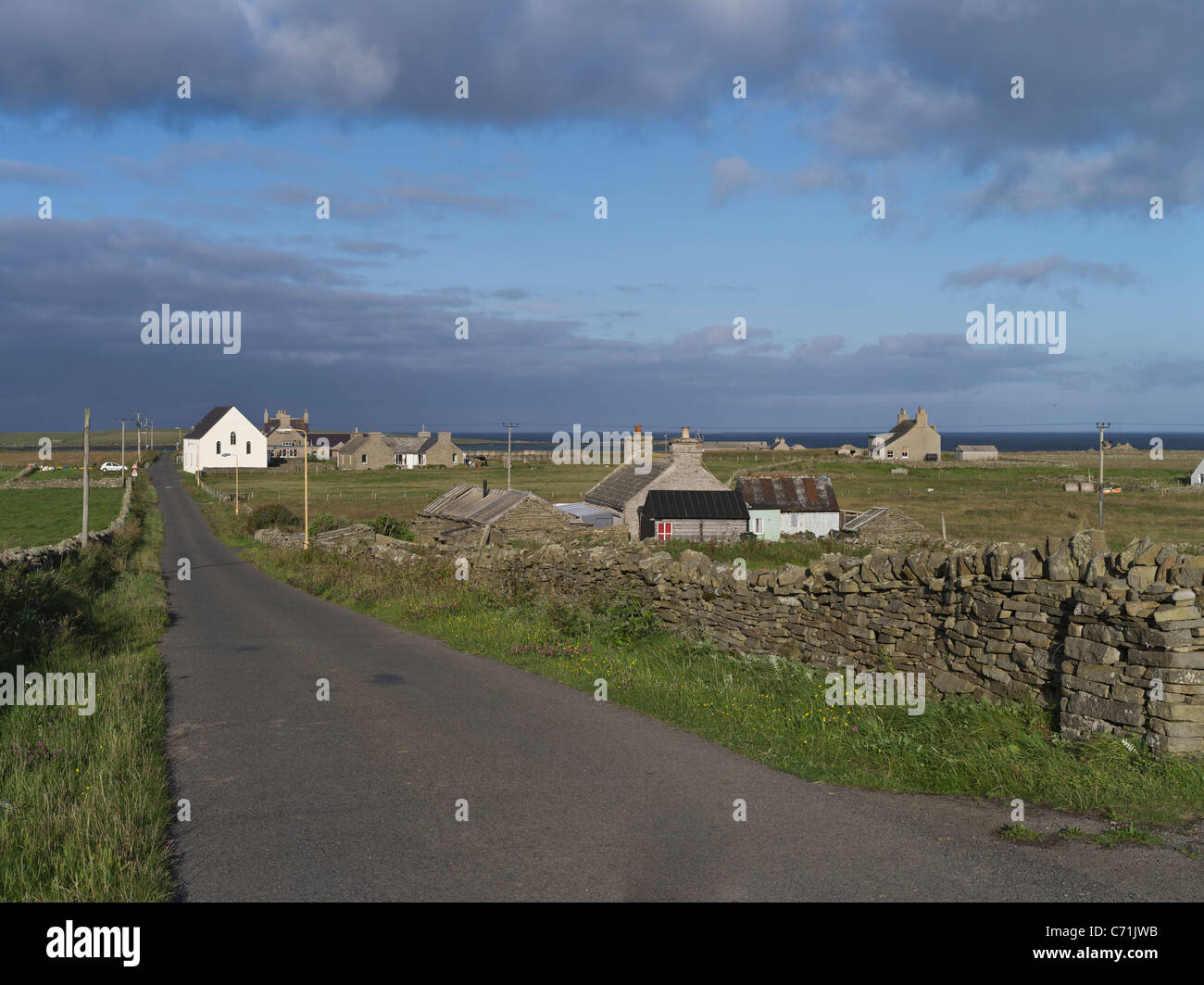 dh  PAPA WESTRAY ORKNEY Houses and St Anns church village road Papa Westry country scotland Stock Photo