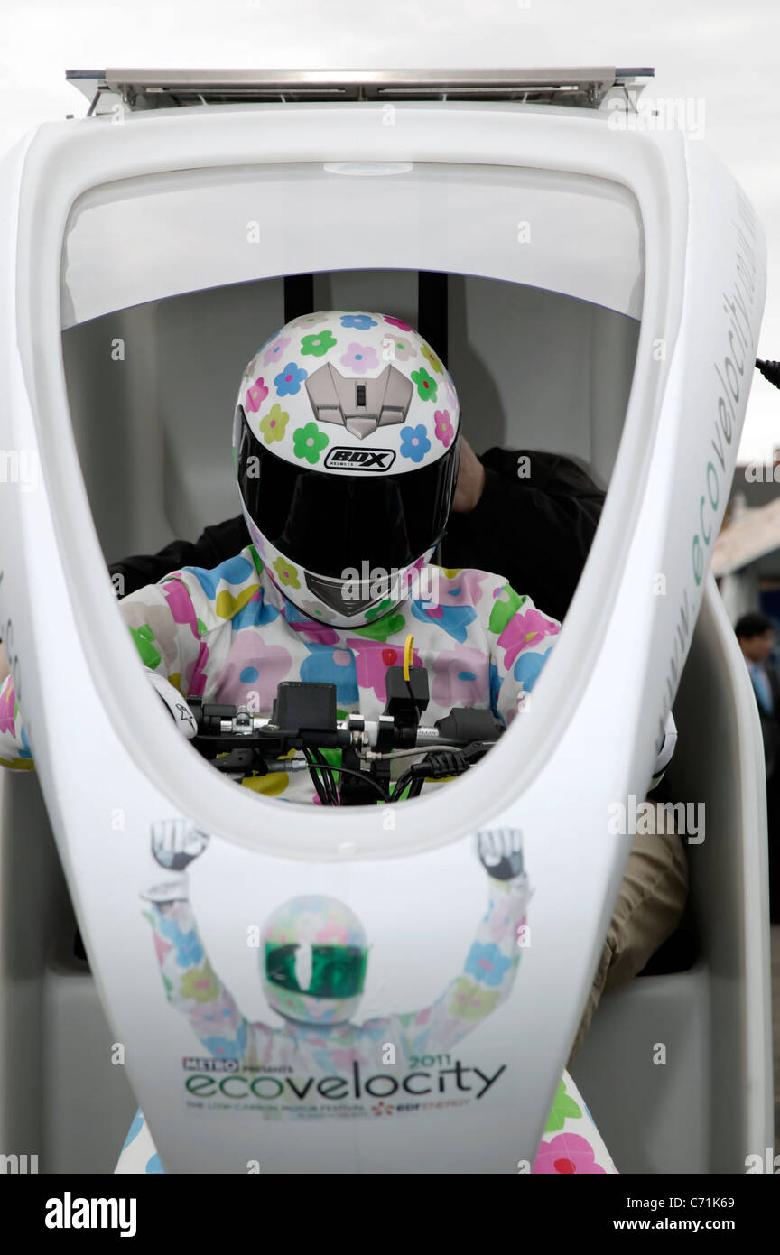 Close-up of The green Stig, driving an electrically assisted bycicle-powered rickshaw at ecovelocity. the low-carbon  motor show Stock Photo