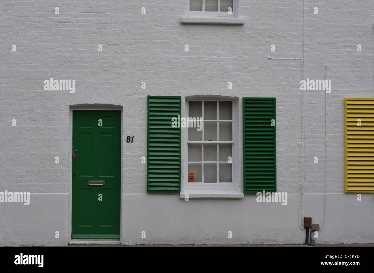 White house with green shutters abstract Sw14 Stock Photo