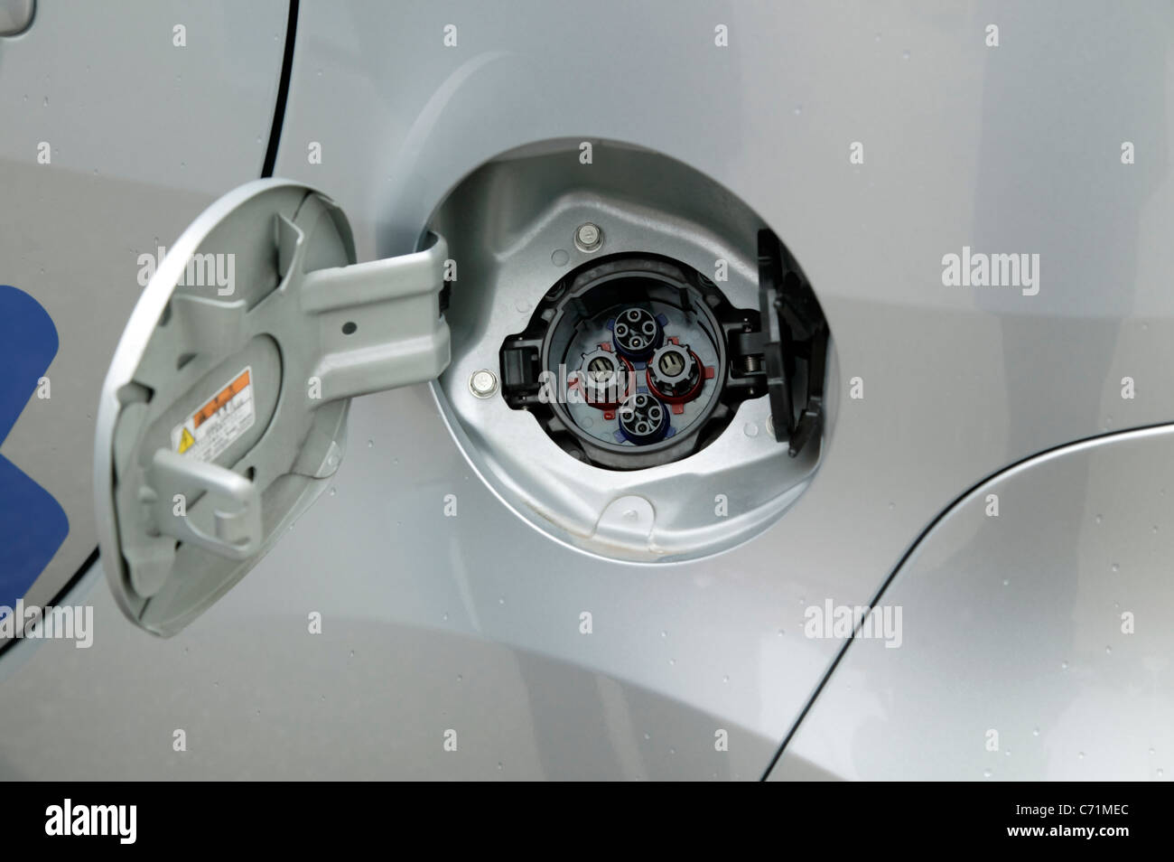 Close-up view of the charging socket on the Peugeot iOn electric vehicle Stock Photo