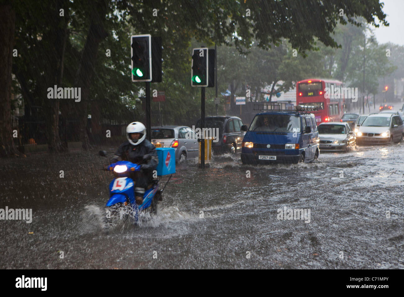 Heavy rain causes flash flooding in Stoke Newington, London. Traffic struggled as torrential rain flooded the area Stock Photo