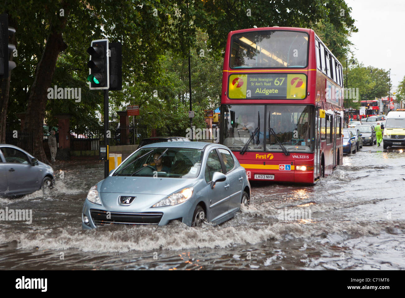 Heavy rain causes flash flooding in Stoke Newington, London. Traffic struggled as torrential rain flooded the area Stock Photo