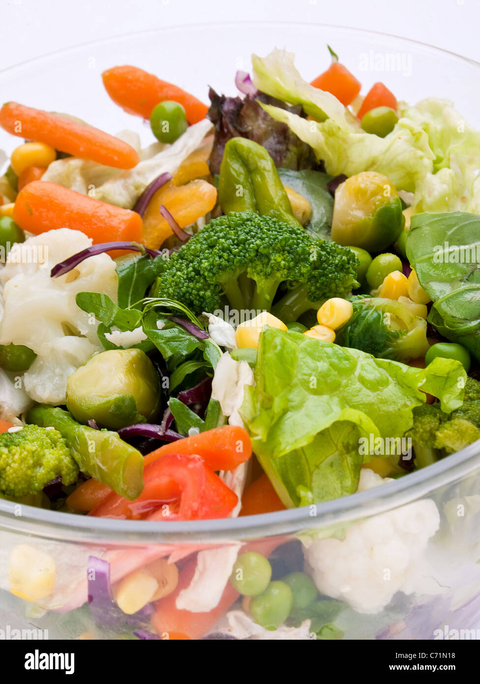Warm vegetable salad in glass with herb Stock Photo