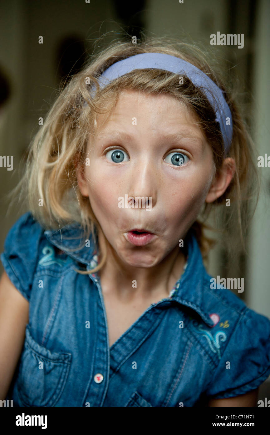 young girl makes silly faces for the camera Stock Photo Alamy
