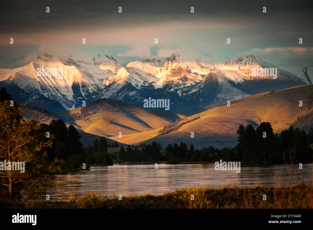 A beautiful river and mountain range at sunset in Montana. Stock Photo