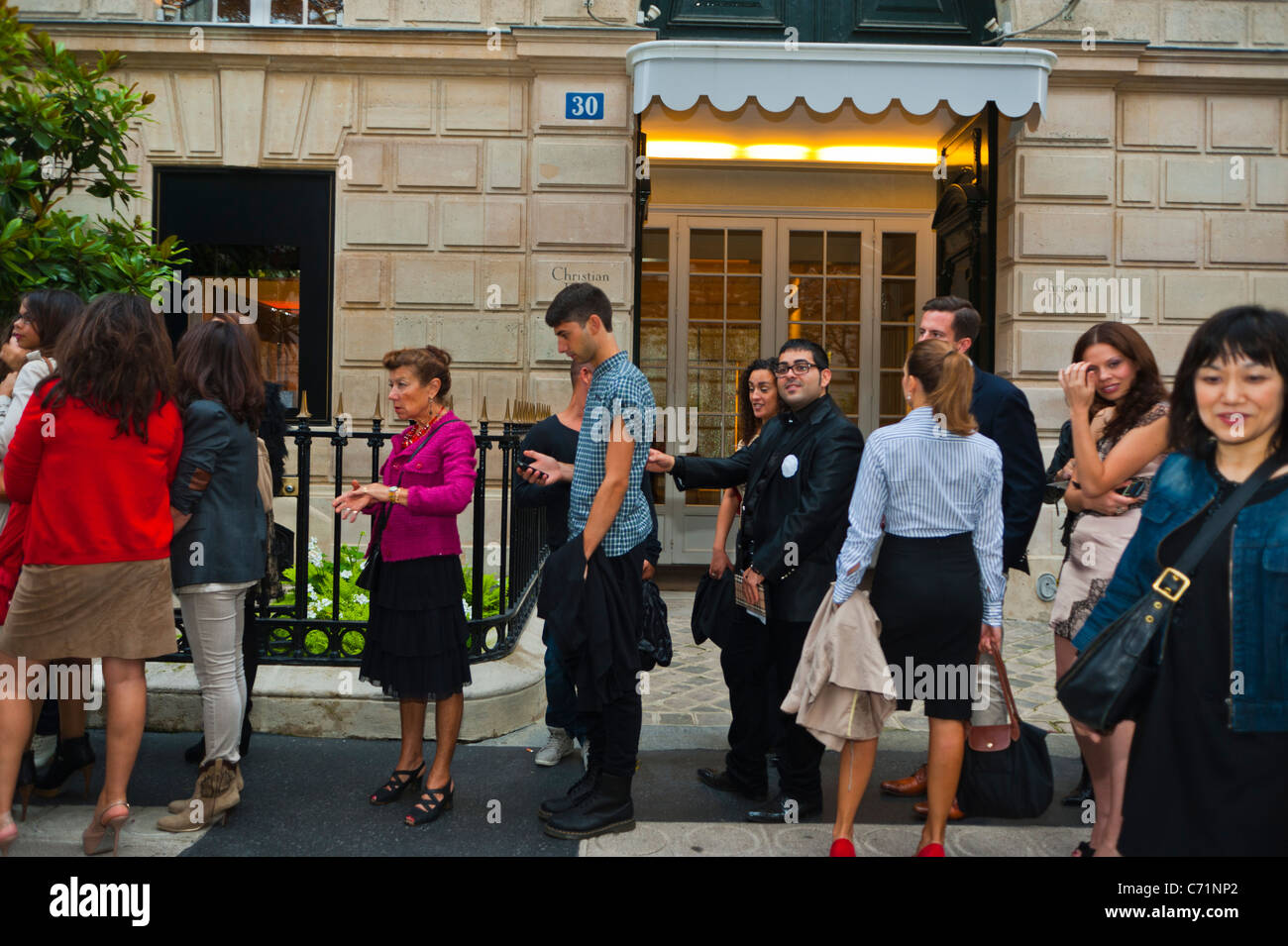 Paris, France, Crowd of French Teenagers Shopping, Queuing Outside Luxury Clothing Shops, at Fashion Ni-ght Event, '30 Avenue Montaigne' Christian Dior, France men and women clothing store Stock Photo
