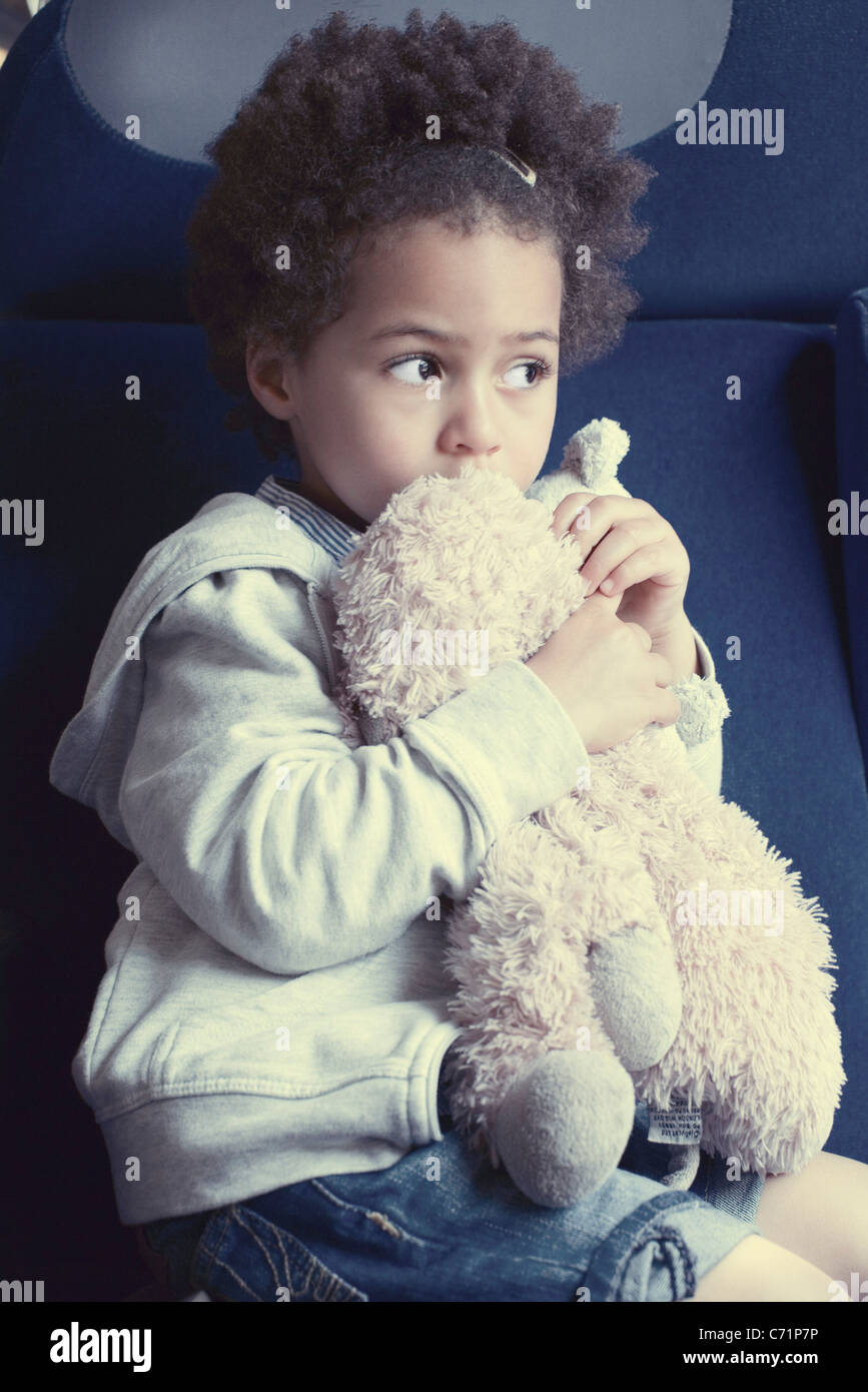 Little girl holding stuffed toy, portrait Stock Photo - Alamy