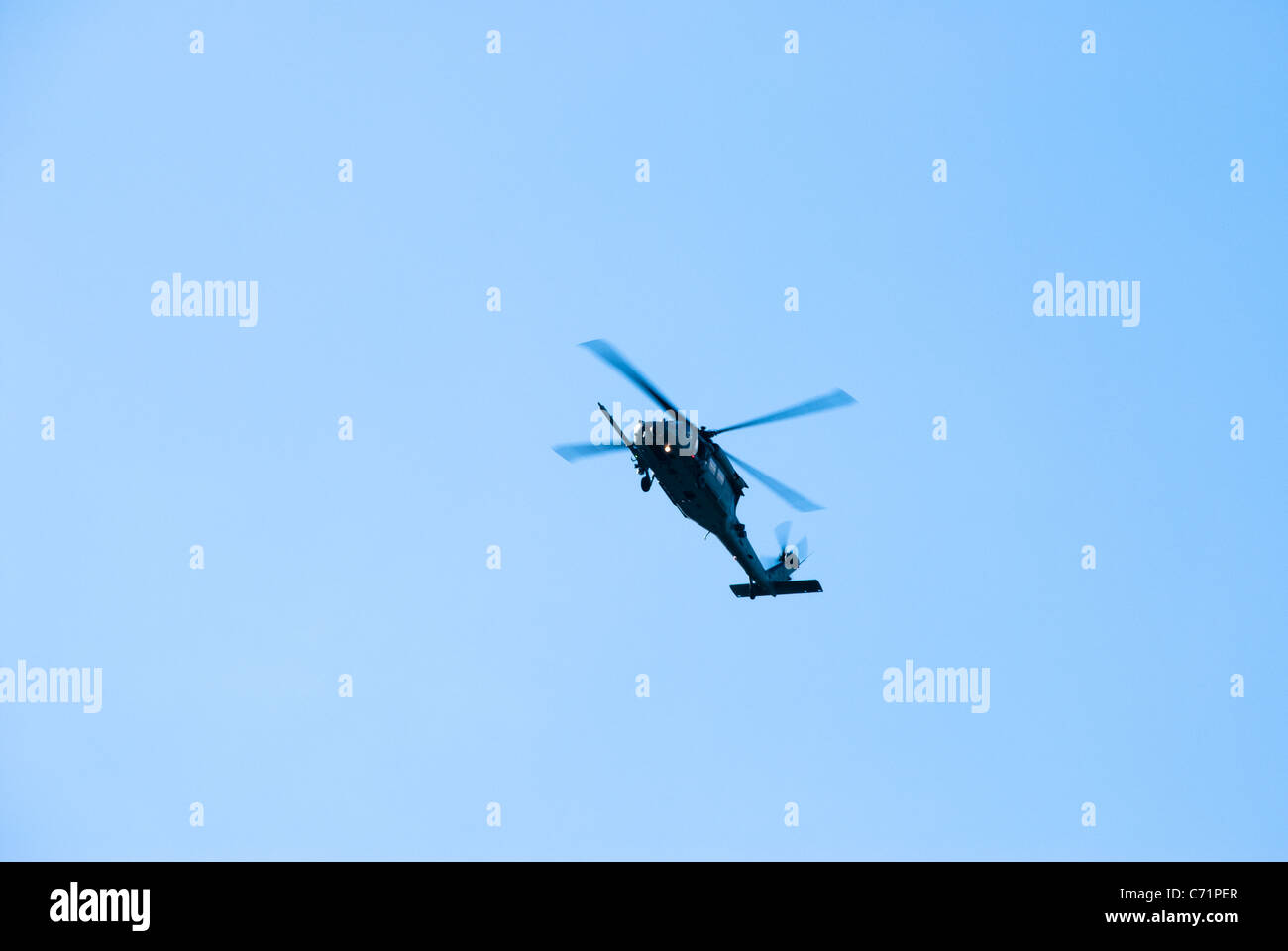 Helicopter in a blue sky Stock Photo