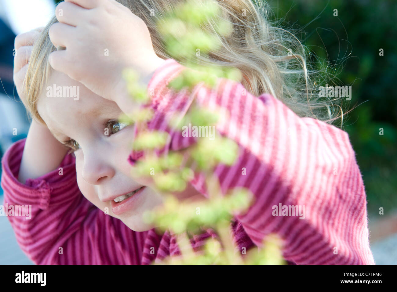 Toddler girl with surprised expression, hands on head Stock Photo - Alamy