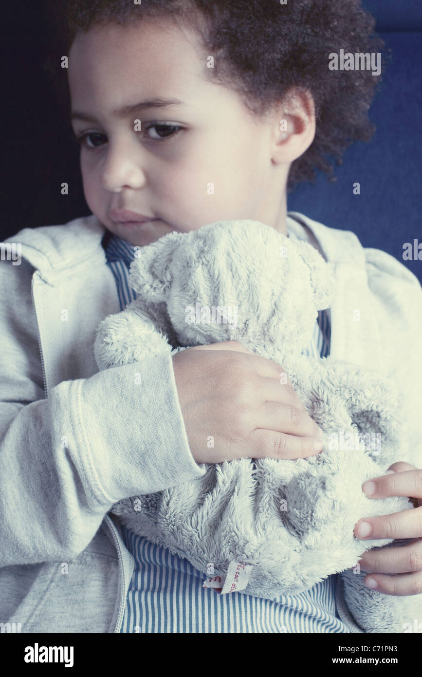 Little girl holding stuffed toy, portrait Stock Photo - Alamy