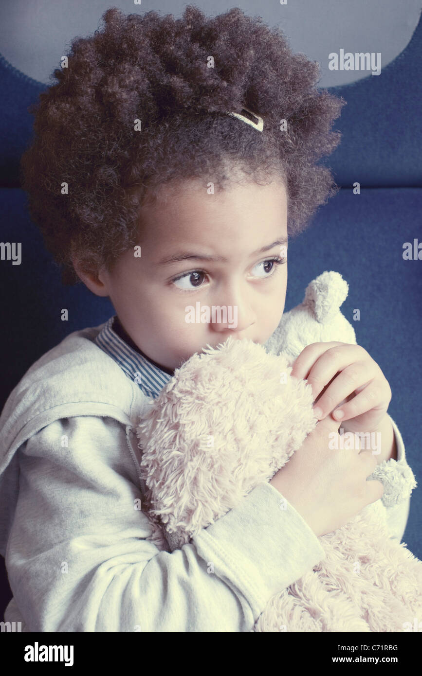Little girl holding stuffed toy, portrait Stock Photo - Alamy