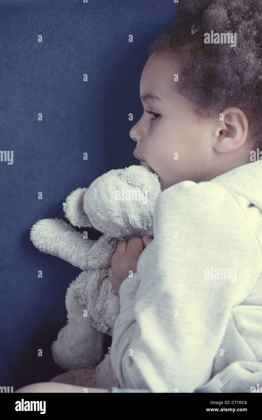 Little girl with stuffed toy Stock Photo - Alamy
