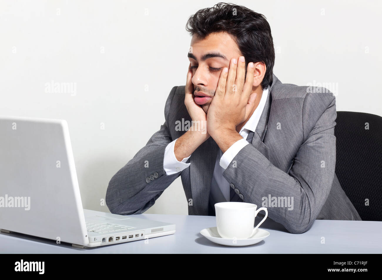 Businessman sleeping at work Stock Photo Alamy