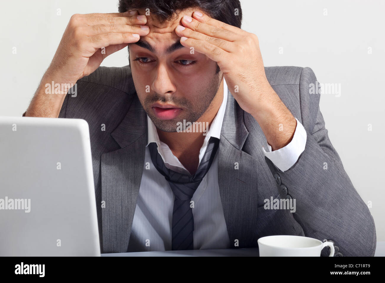 Businessman stressed at work Stock Photo
