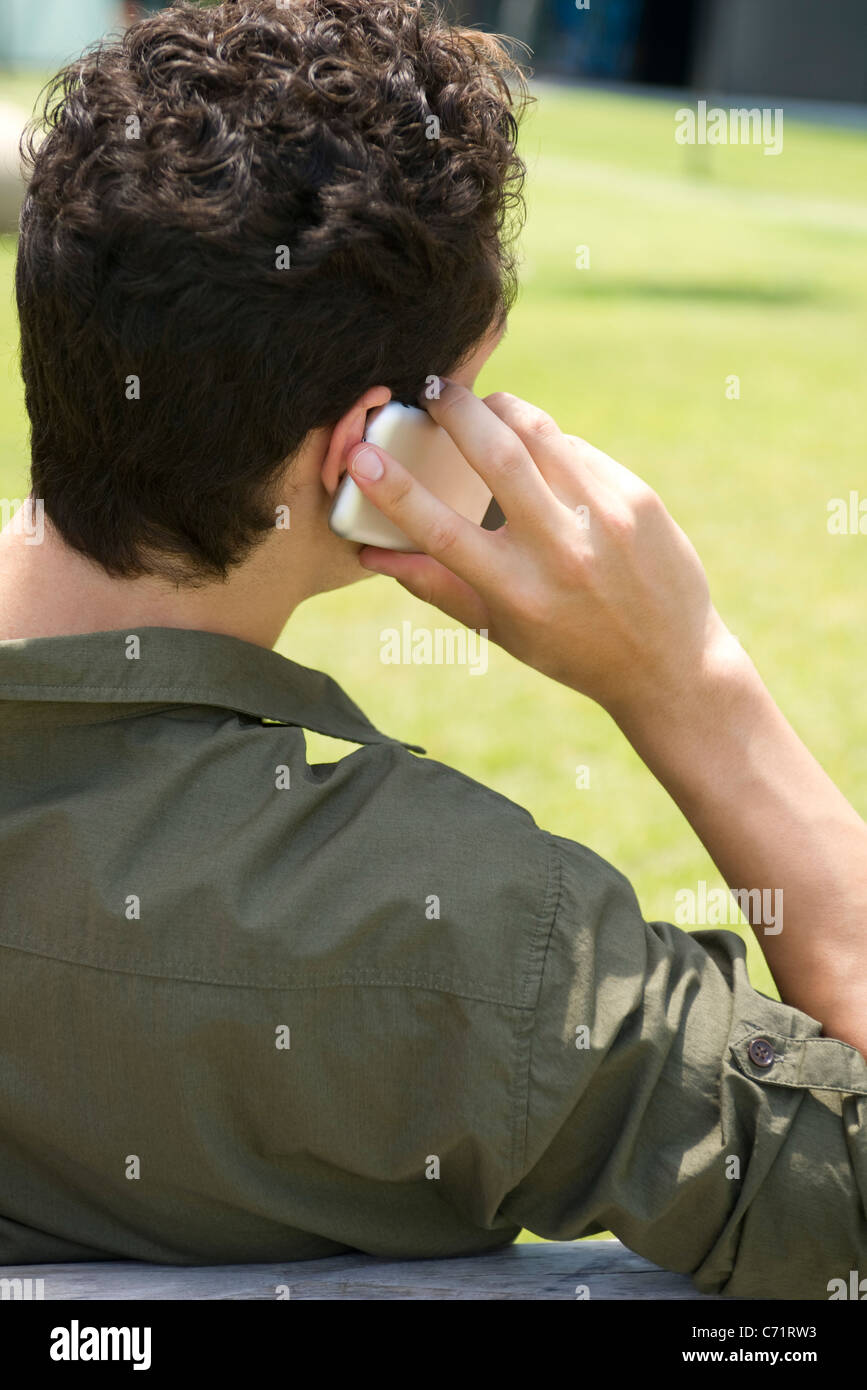 Talking on the phone rear view hi-res stock photography and images - Alamy