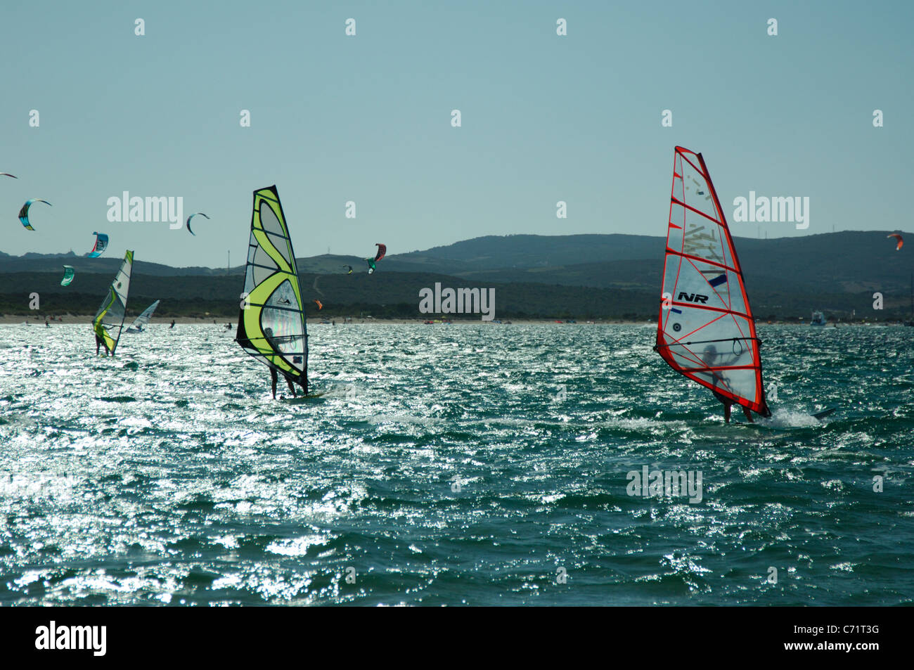 Windsurf an kitesurf sailing at Porto Pollo bay and beach,Palau Stock