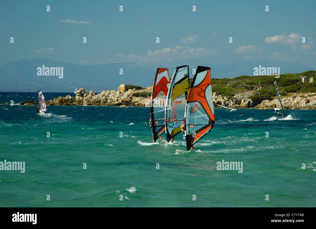 Windsurfs sailing at Porto Pollo bay,Palau, Sardinia Stock Photo