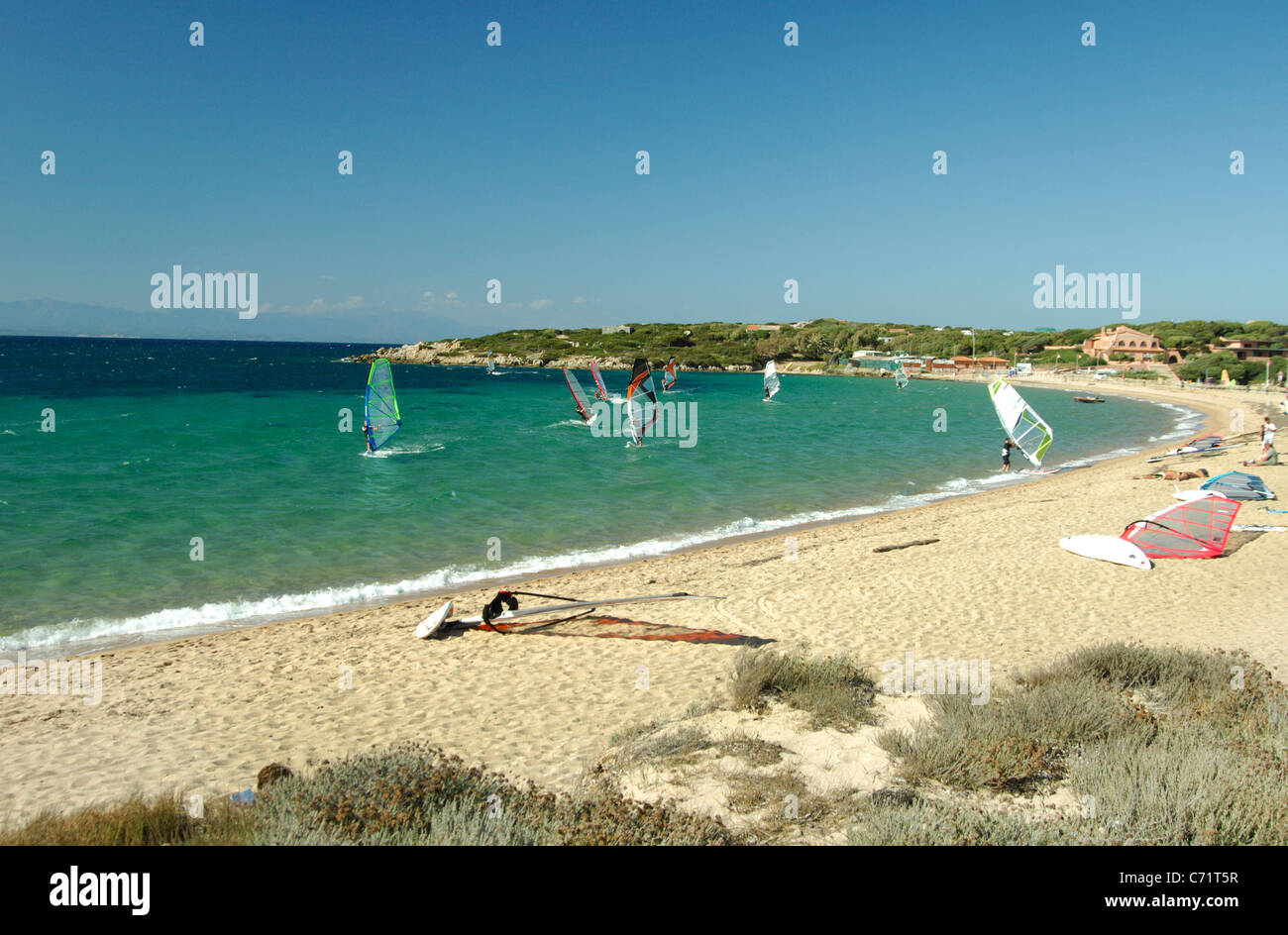 Windsurfs sailing at Porto Pollo bay and beach,Palau, Sardinia Stock Photo
