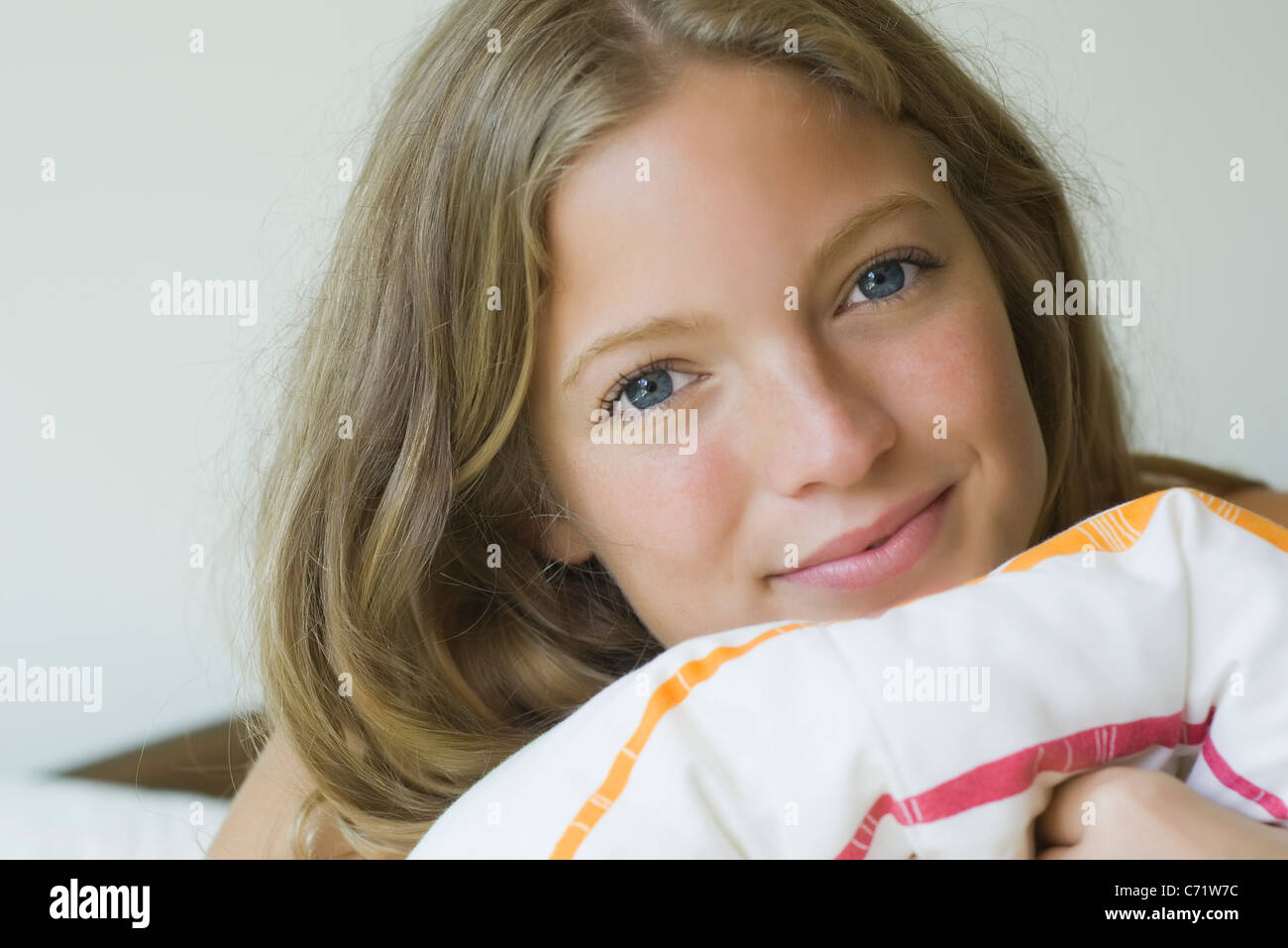 Young woman resting head on pillow, portrait Stock Photo Alamy