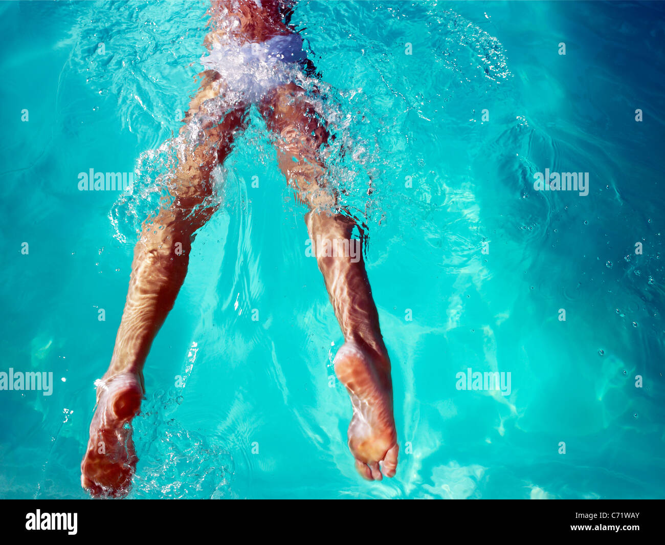 Women in swimming pool legs only view Stock Photo Alamy