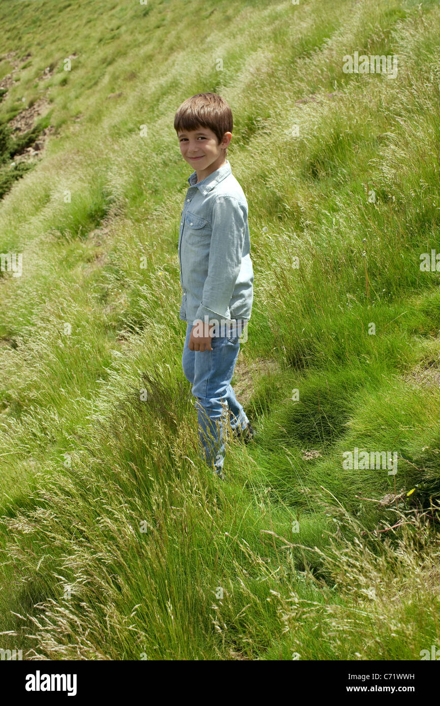 Boy walking on hillside, portrait Stock Photo Alamy