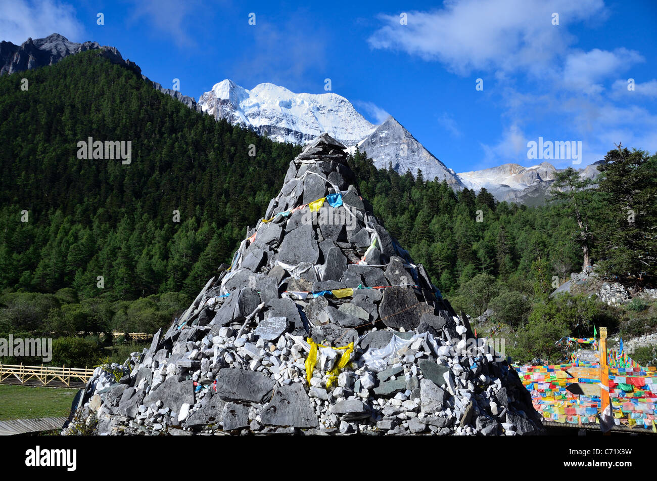 A Tibetan mani stone pile at Yading Nature Reserve. Daocheng, Sichuan, China. Stock Photo