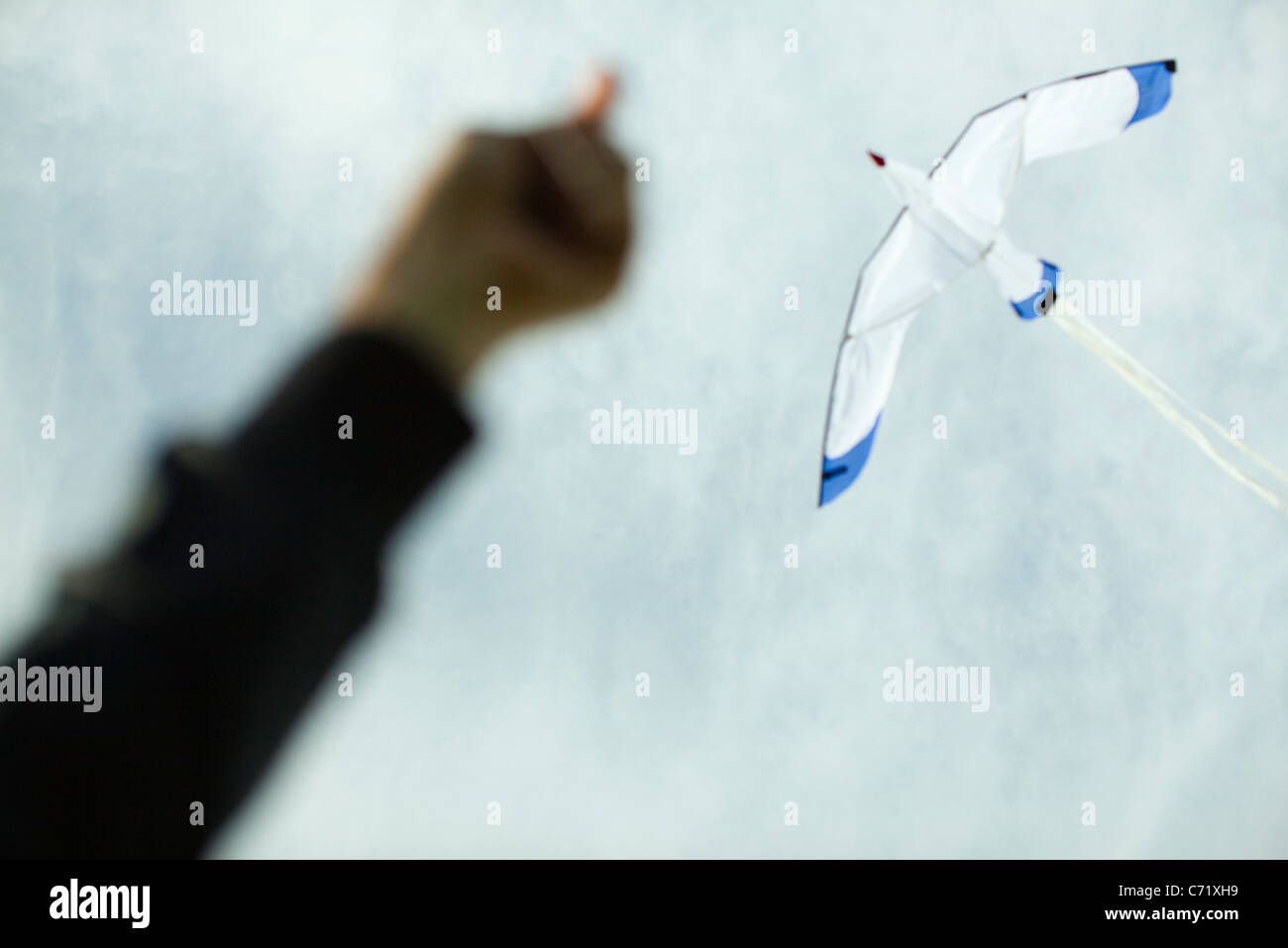 Flying a kite, low angle view Stock Photo
