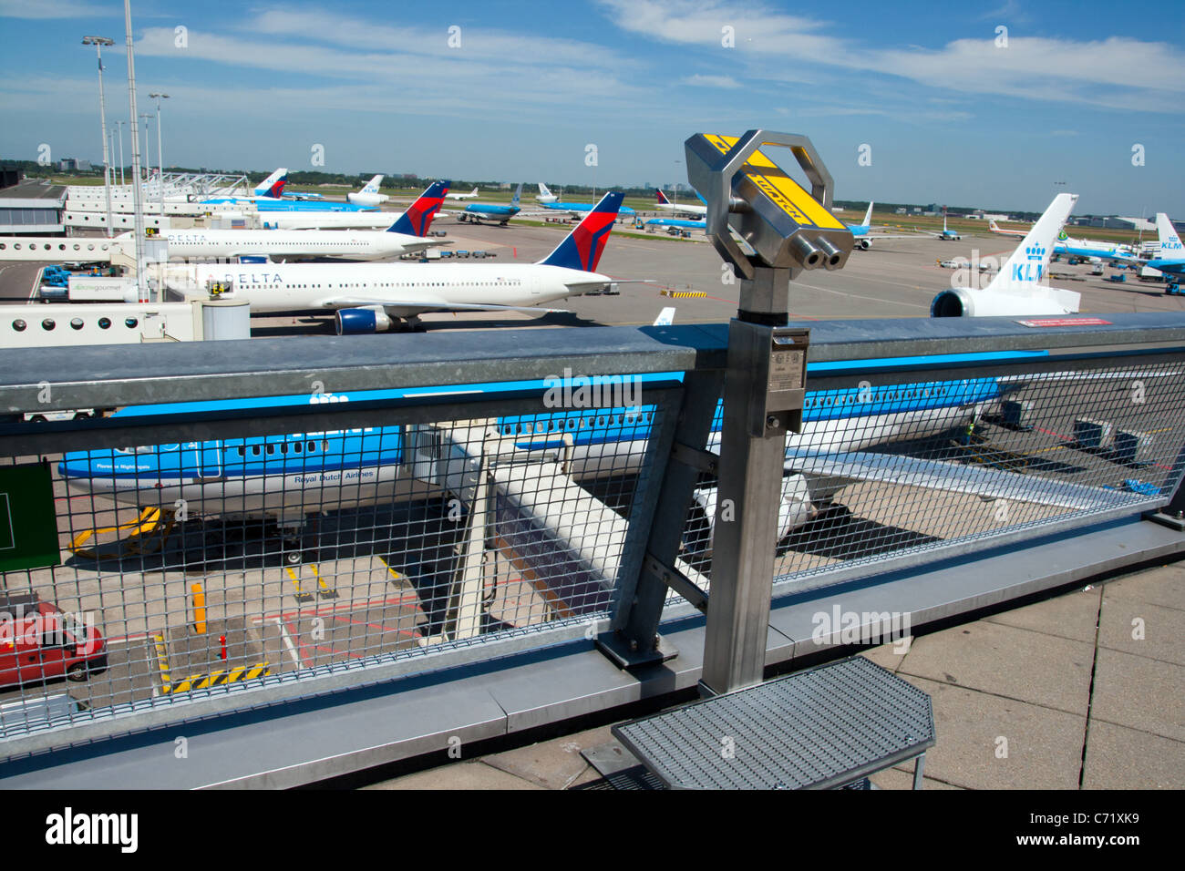 Row of planes seen fromt he viewing deck at Amsterdam-Schiphol airport in Holland Stock Photo