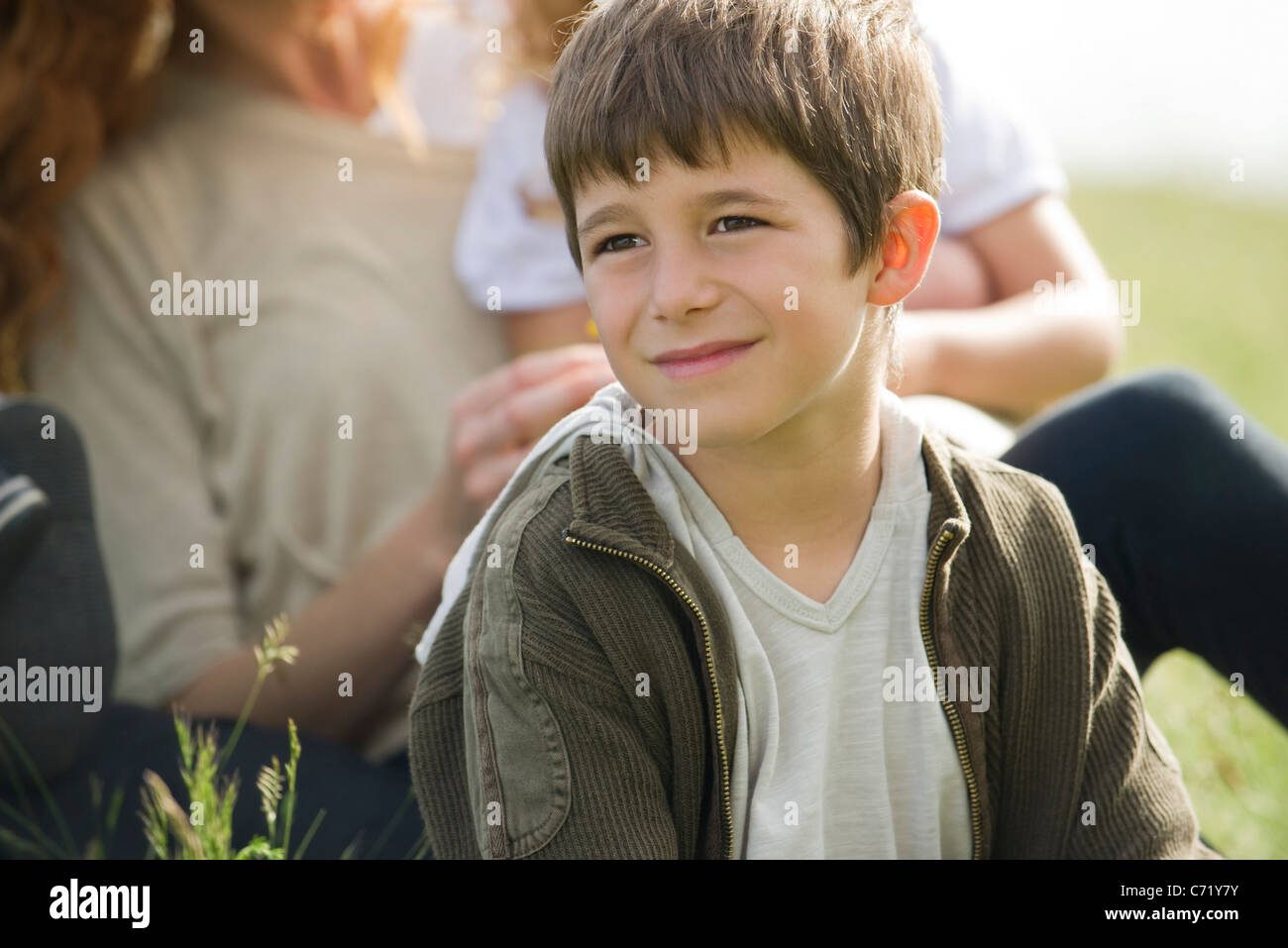 Boy looking away in thought Stock Photo - Alamy