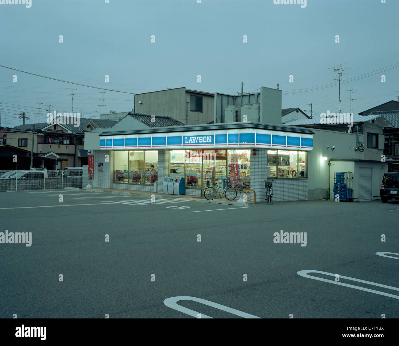 An empty parking lot in front of a convenience store. Stock Photo